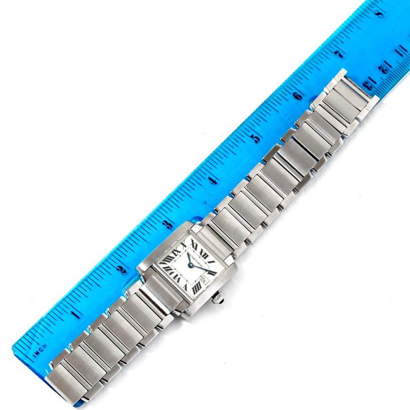 The image shows a Cartier Tank Francaise W51011Q3 Women's Stainless Steel Silver Dial W51011Q3 Women's Stainless Steel Silver Dial watch laid flat and measured with a blue ruler, highlighting its band length and face.