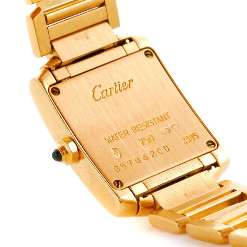 The underside of the Cartier Tank Française watch is shown from an angled view, displaying the back plate and part of the bracelet.