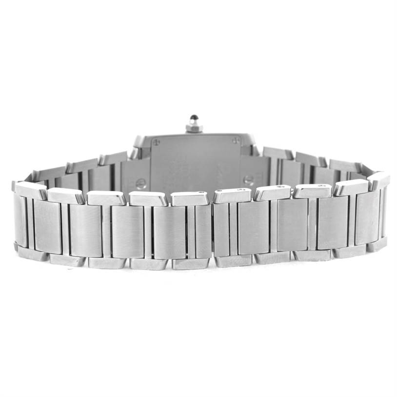 The image shows the back view of the Tank Française Cartier watch, focusing on the watch's stainless steel bracelet.