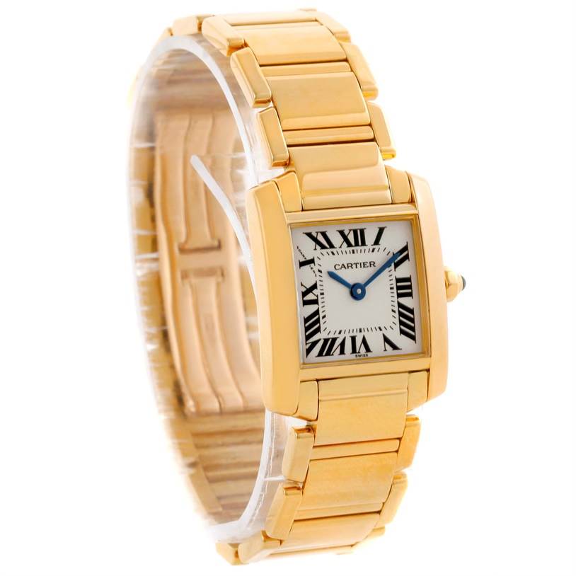 The photo shows a Cartier Tank Francaise W50002N2 Women's Yellow Gold Silver Dial W50002N2 Women's Yellow Gold Silver Dial watch at a three-quarter angle, highlighting its square face, Roman numeral dial, and gold bracelet.