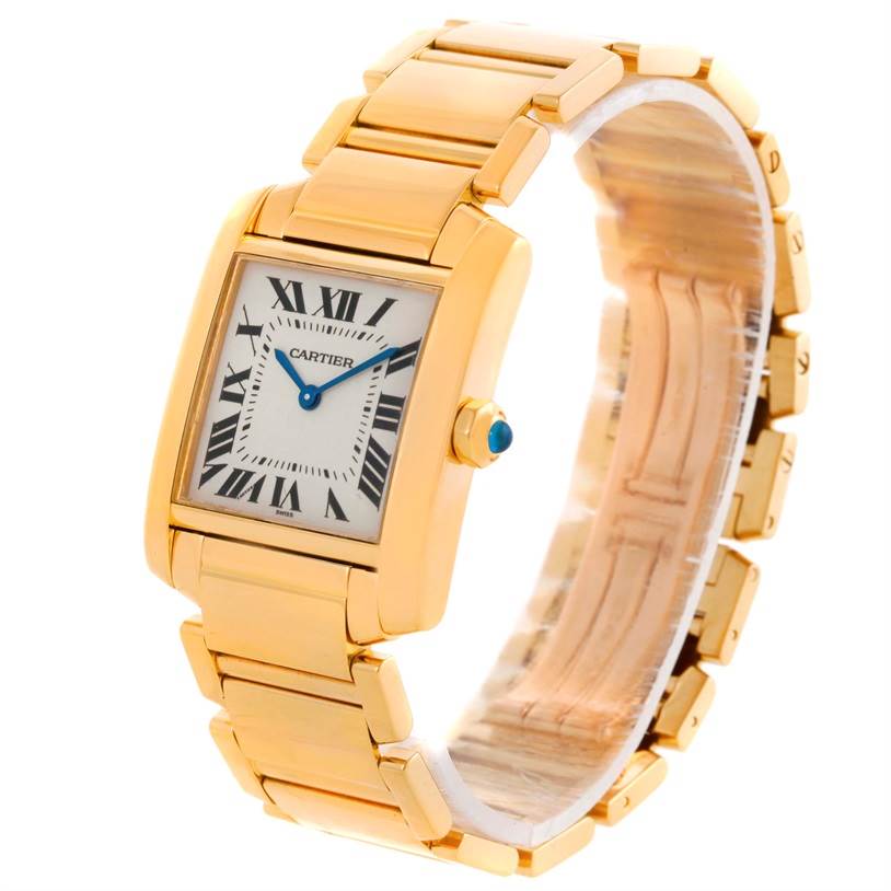The image shows a Cartier Tank Francaise W50003N2 Women's Yellow Gold Silver Dial W50003N2 Women's Yellow Gold Silver Dial watch angled to display the face and gold bracelet.