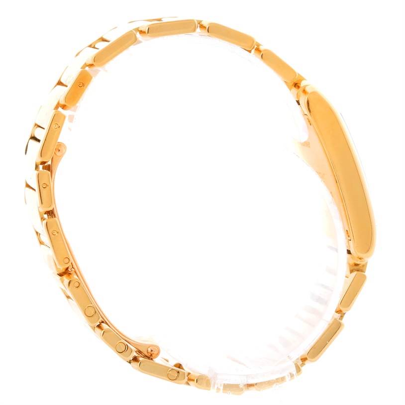 The image shows a side view of the Cartier Tank Francaise W50003N2 Women's Yellow Gold Silver Dial W50003N2 Women's Yellow Gold Silver Dial watch, focusing on the gold bracelet and case.