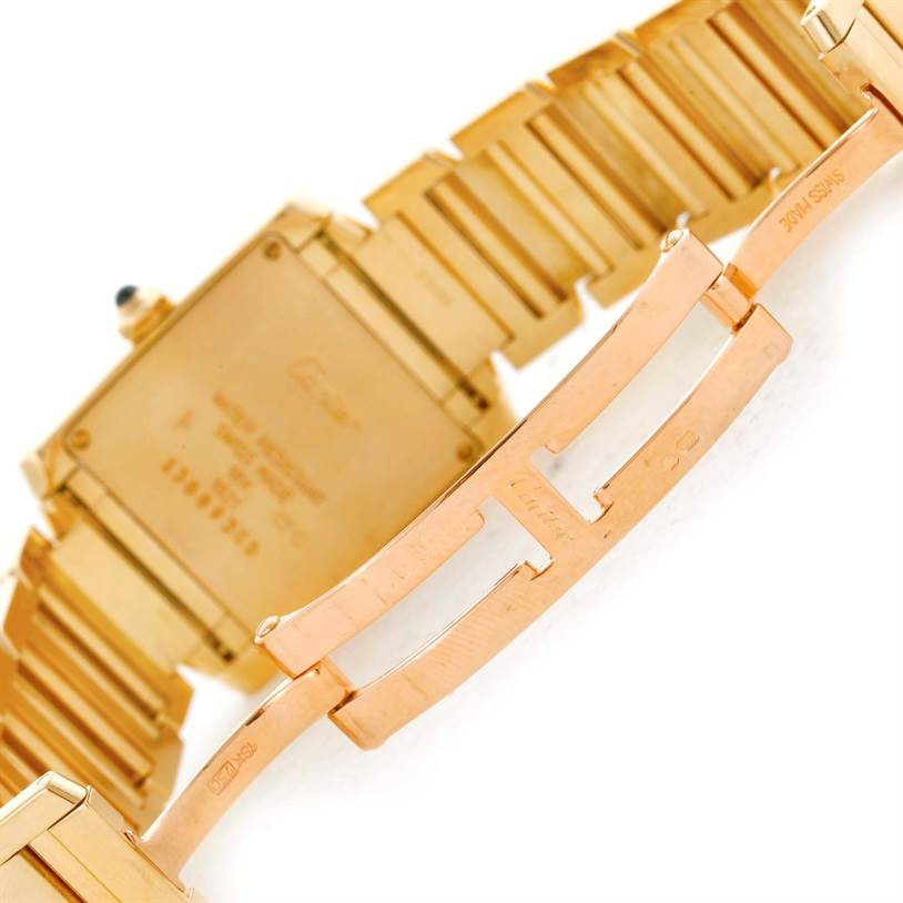 This image shows a close-up of the back case and bracelet clasp of a Cartier Tank Francaise W50003N2 Women's Yellow Gold Silver Dial W50003N2 Women's Yellow Gold Silver Dial watch.