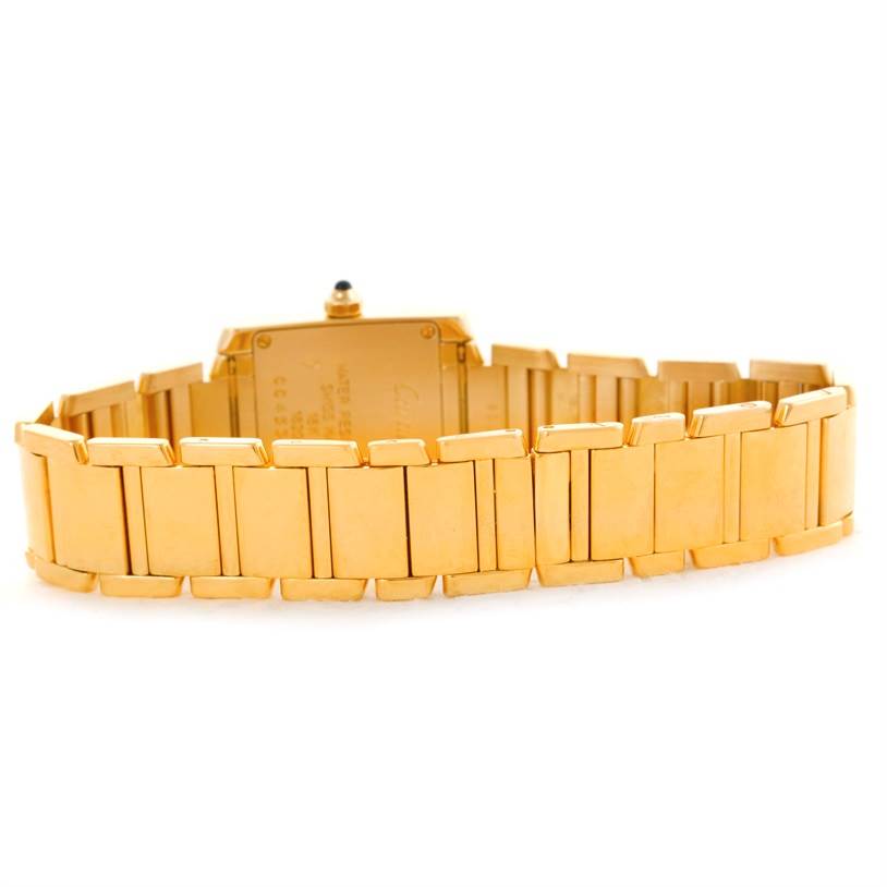 The image shows the back view of the Cartier Tank Francaise W50002N2 Women's Yellow Gold Silver Dial W50002N2 Women's Yellow Gold Silver Dial watch, highlighting its gold bracelet and case back.