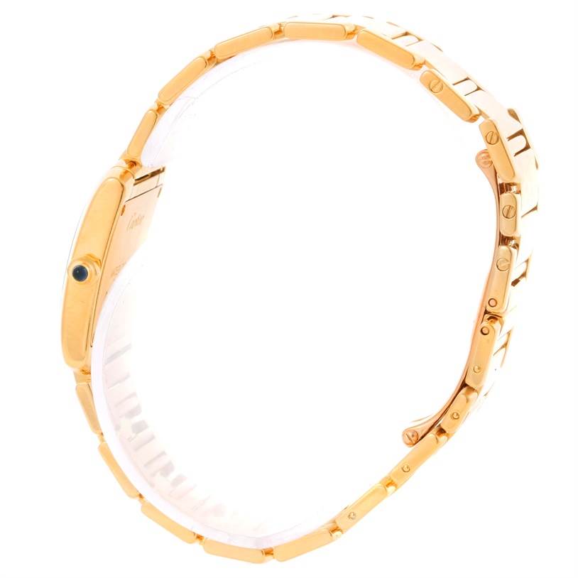 The image shows a side view of the Cartier Tank Francaise W50002N2 Women's Yellow Gold Silver Dial W50002N2 Women's Yellow Gold Silver Dial watch, including its gold bracelet and side profile.