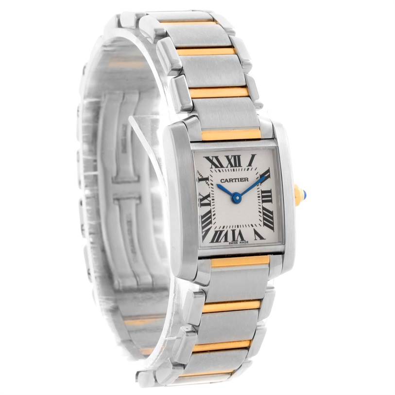 The image shows a Cartier Tank Française watch angled to display its face, Roman numerals, and metal bracelet with gold accents.