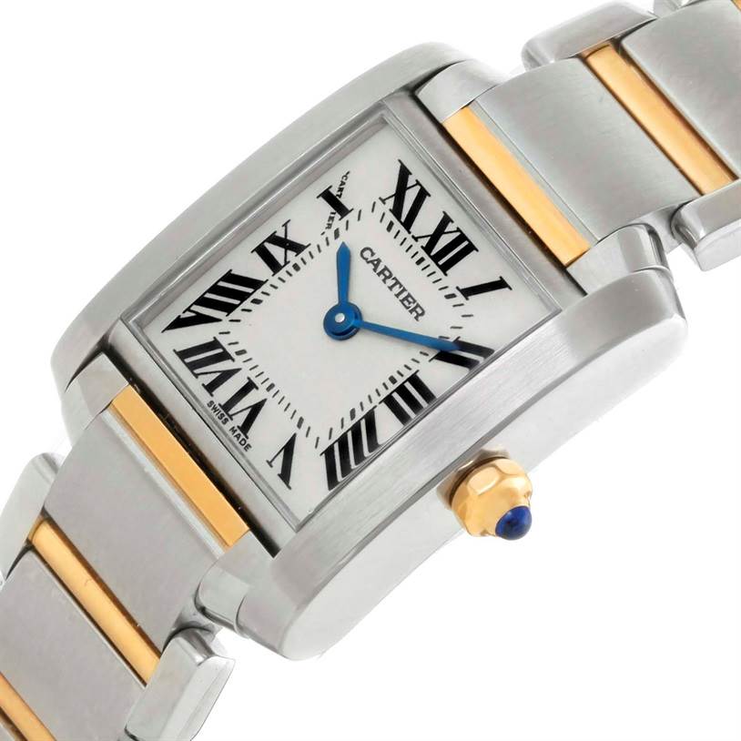 The image shows a Cartier Tank Française watch at a slight angle highlighting the face, Roman numerals, blue hands, and steel-gold bracelet.