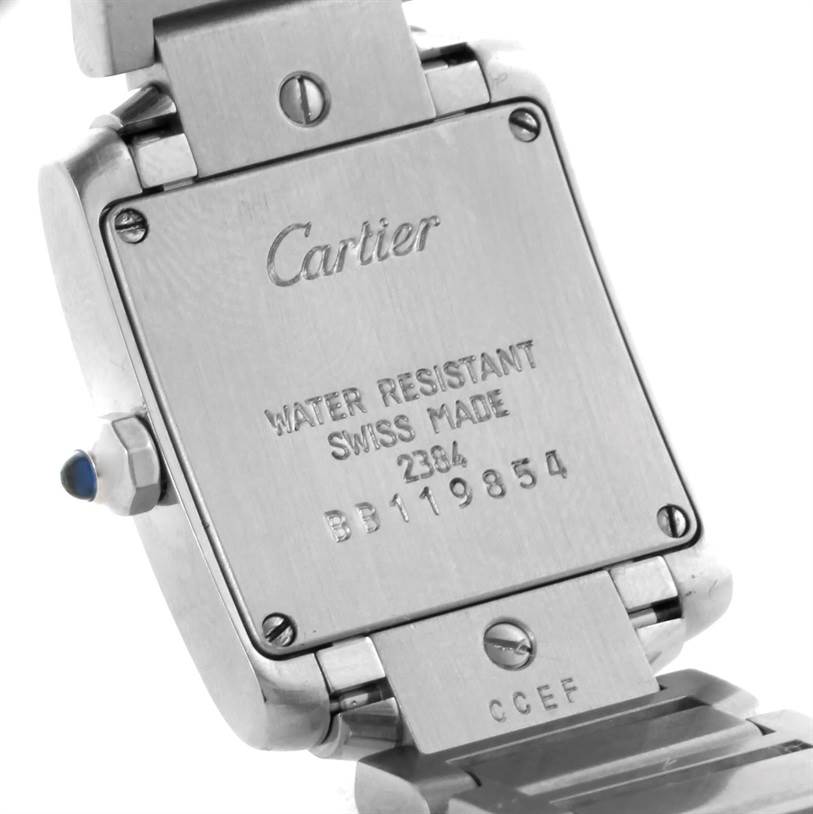 The image shows the back case of a Cartier Tank Française watch, including its bracelet attachment and serial number.