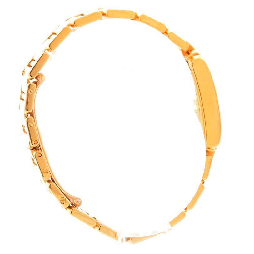 The image shows a side profile view of the gold bracelet and case of a Cartier Tank Française watch.