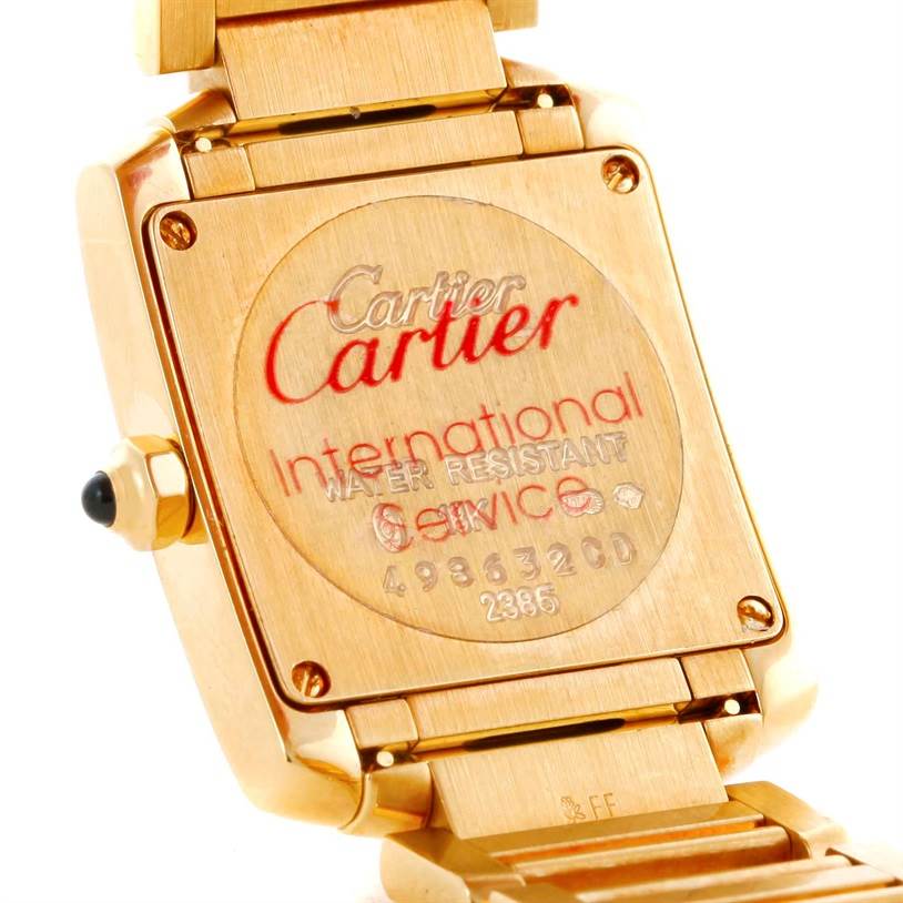 This image shows the back case and bracelet of the Cartier Tank Francaise W50002N2 Women's Yellow Gold Silver Dial W50002N2 Women's Yellow Gold Silver Dial watch, highlighting the engraved branding and details.