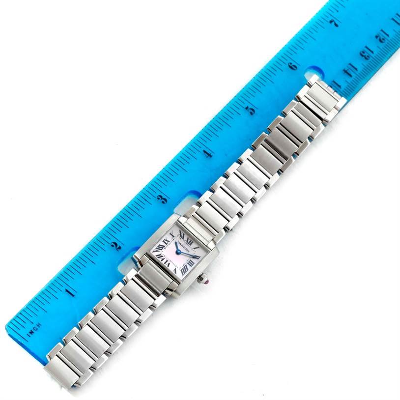 The Cartier Tank Francaise W51028Q3 Women's Stainless Steel Mother of Pearl Dial W51028Q3 Women's Stainless Steel Mother of Pearl Dial watch is shown from an overhead angle alongside a blue ruler for size reference.