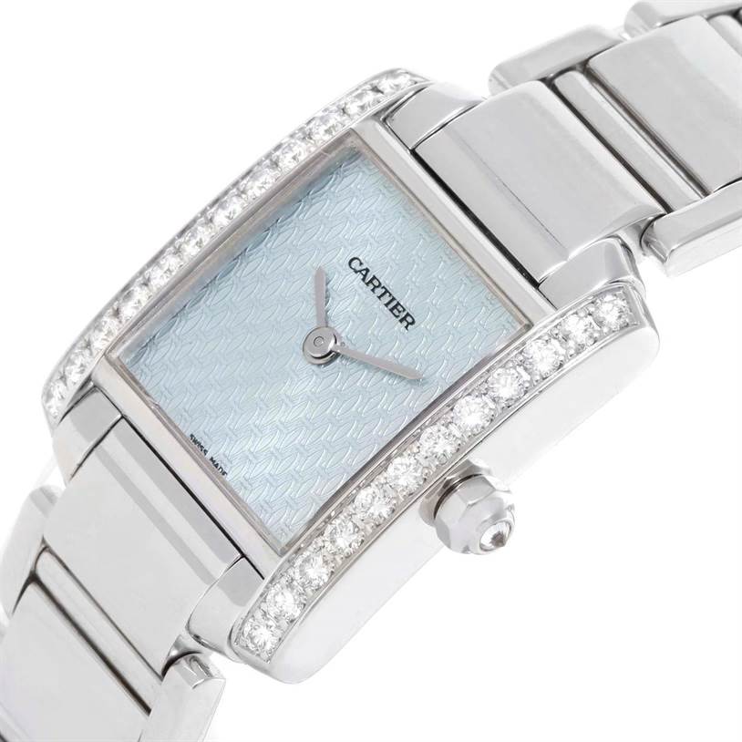 This image features an angled close-up of the Cartier Tank Francaise WE1002S3 Women's White Gold Blue Dial WE1002S3 Women's White Gold Blue Dial watch, highlighting the dial, diamond bezel, case, bracelet, and crown.