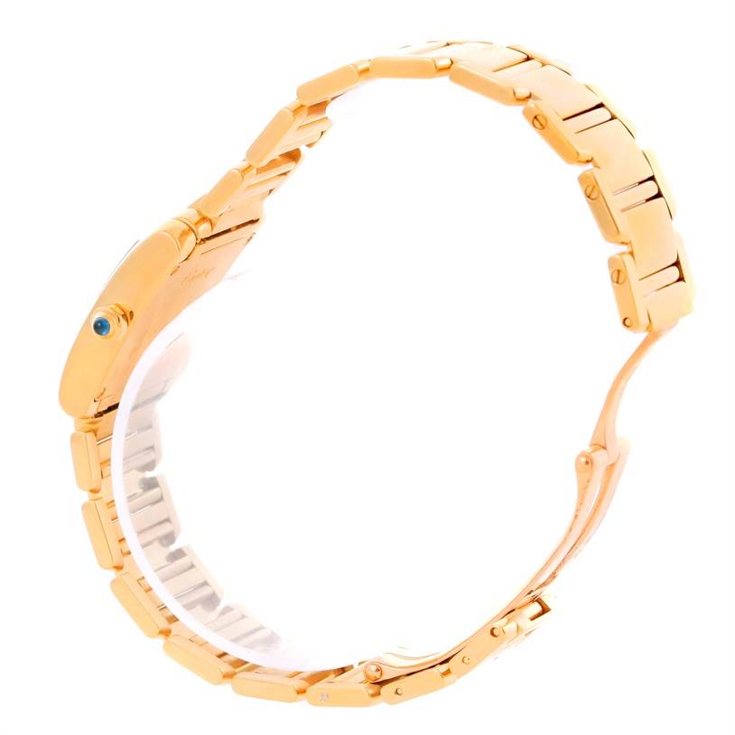 Side view of the Cartier Tank Francaise W50002N2 Women's Yellow Gold Silver Dial W50002N2 Women's Yellow Gold Silver Dial watch showing its gold bracelet and case.