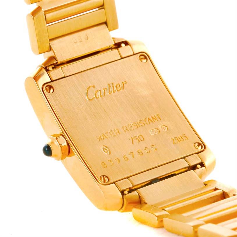 The image shows the back and part of the bracelet of a Cartier Tank Française watch.