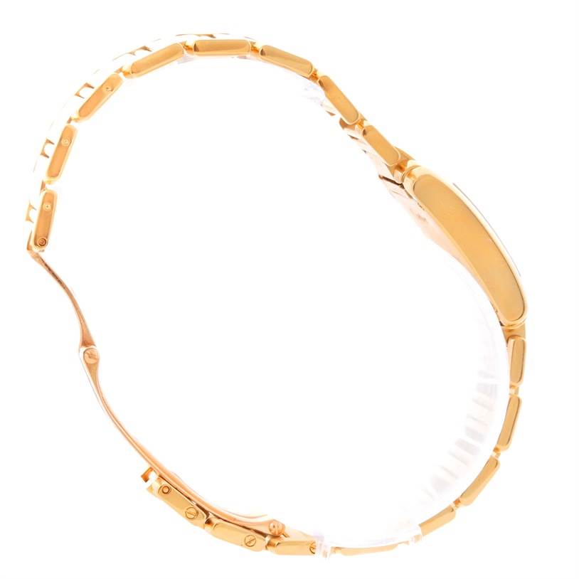 The image shows a side view of a Cartier Tank Francaise W50002N2 Women's Yellow Gold Silver Dial W50002N2 Women's Yellow Gold Silver Dial watch, highlighting its gold bracelet and case.