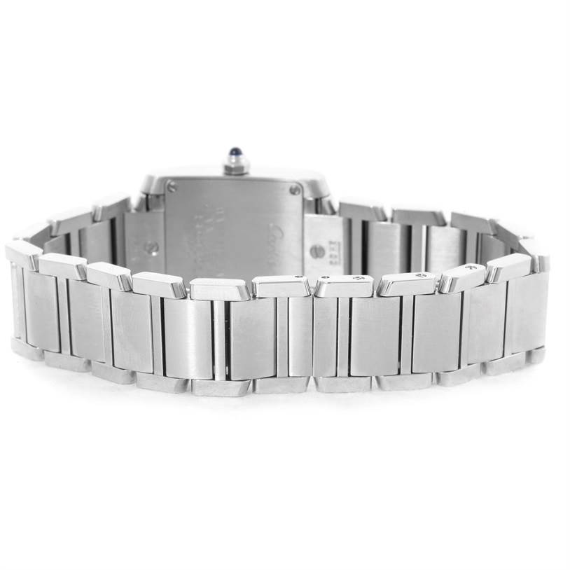 The image shows the back view of the bracelet and case of a Cartier Tank Française watch.