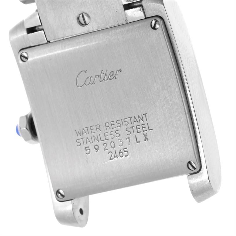 The image shows the back case of a Cartier Tank Française watch, displaying model details and water resistance.