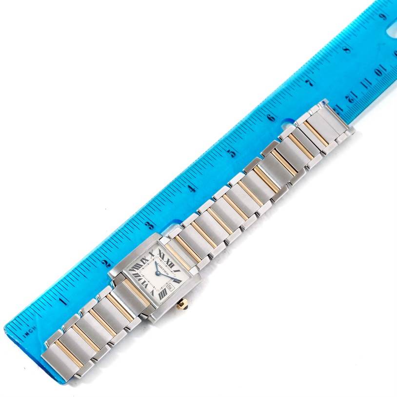 The Cartier Tank Francaise W51012Q4 Women's Steel and Gold (two tone) Silver Dial W51012Q4 Women's Steel and Gold (two tone) Silver Dial watch is shown flat, with the case and bracelet visible alongside a ruler for scale.