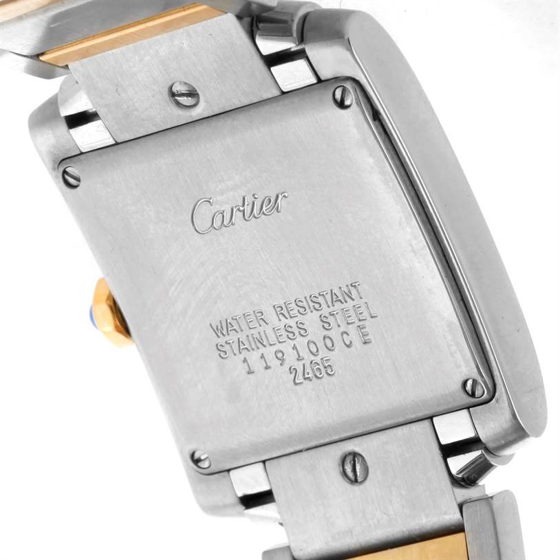 The image shows the back case and part of the bracelet of a Cartier Tank Française watch.