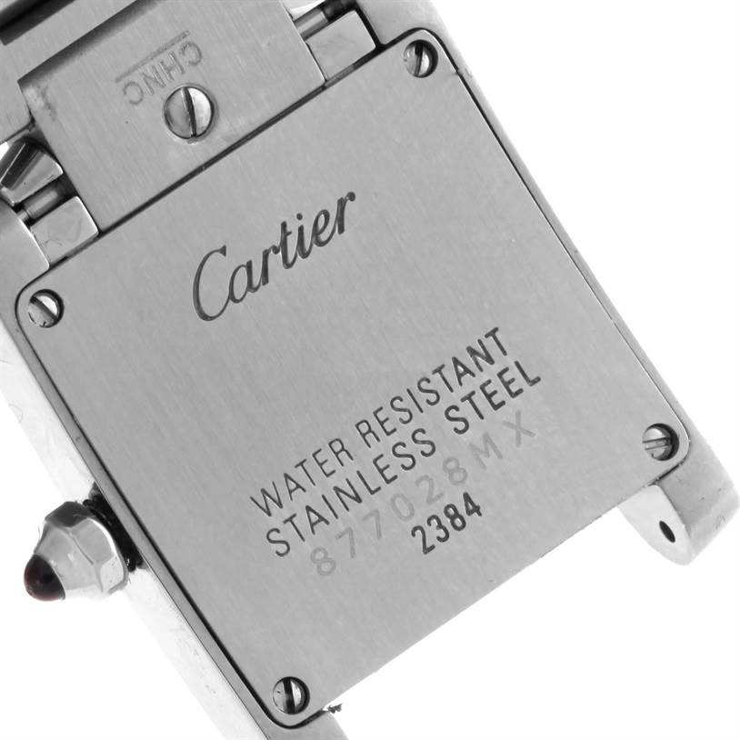 The image shows the back side of a Cartier Tank Française watch, highlighting its water resistance and stainless steel back case.