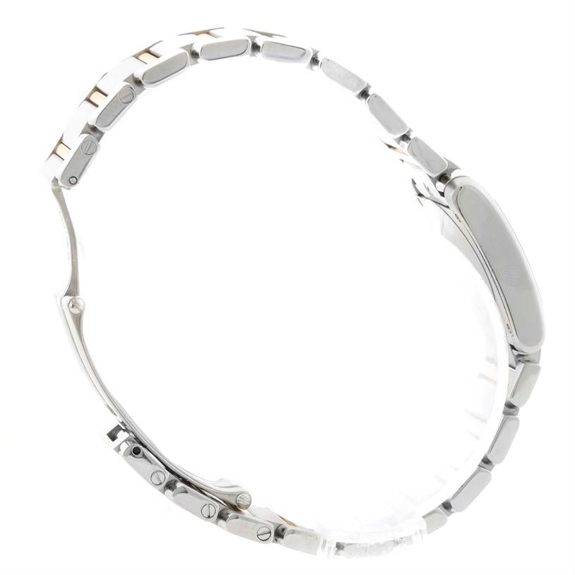 The image shows a side profile of a Cartier Tank Française watch, highlighting its stainless steel bracelet and case.