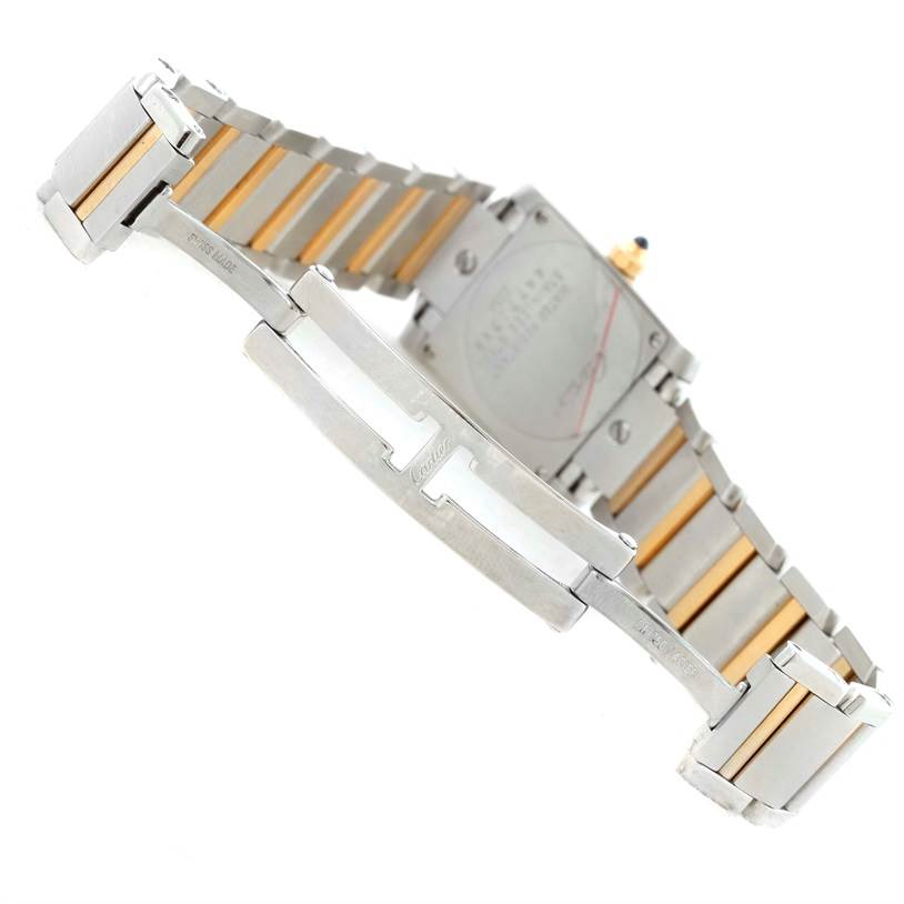 The image shows the back and bracelet of a Cartier Tank Francaise W51007Q4 Women's Steel and Gold (two tone) Silver Dial W51007Q4 Women's Steel and Gold (two tone) Silver Dial watch at an angle, highlighting the clasp and metal links.