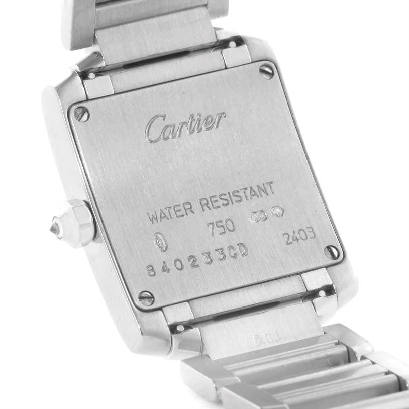 The image shows the back case and part of the bracelet of a Cartier Tank Française watch.