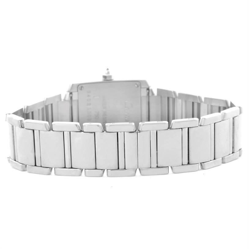 The image shows the back view of the Tank Française Cartier watch, highlighting its stainless steel bracelet and case back.