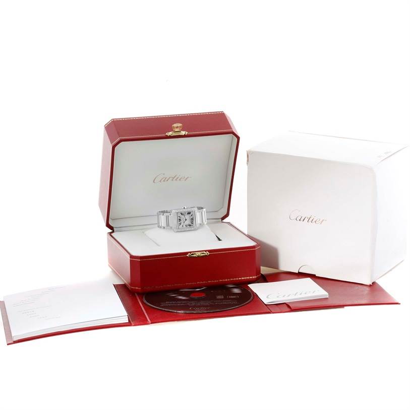 The Cartier Tank Francaise WE1018S3 Women's White Gold Silver Dial WE1018S3 Women's White Gold Silver Dial watch is displayed in its open box, along with packaging, documentation, and a CD.