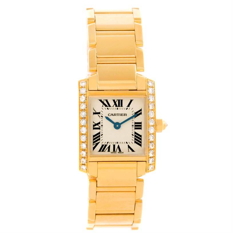 The image shows a front view of the Cartier Tank Francaise WE1001R8 Women's Yellow Gold Silver Dial WE1001R8 Women's Yellow Gold Silver Dial watch, showcasing its gold bracelet, diamond-set bezel, and rectangular dial.