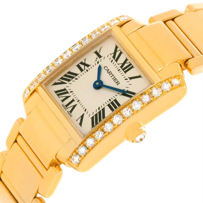 This image shows a close-up angle of the Cartier Tank Francaise WE1001R8 Women's Yellow Gold Silver Dial WE1001R8 Women's Yellow Gold Silver Dial watch's face, bezel, and parts of the bracelet.