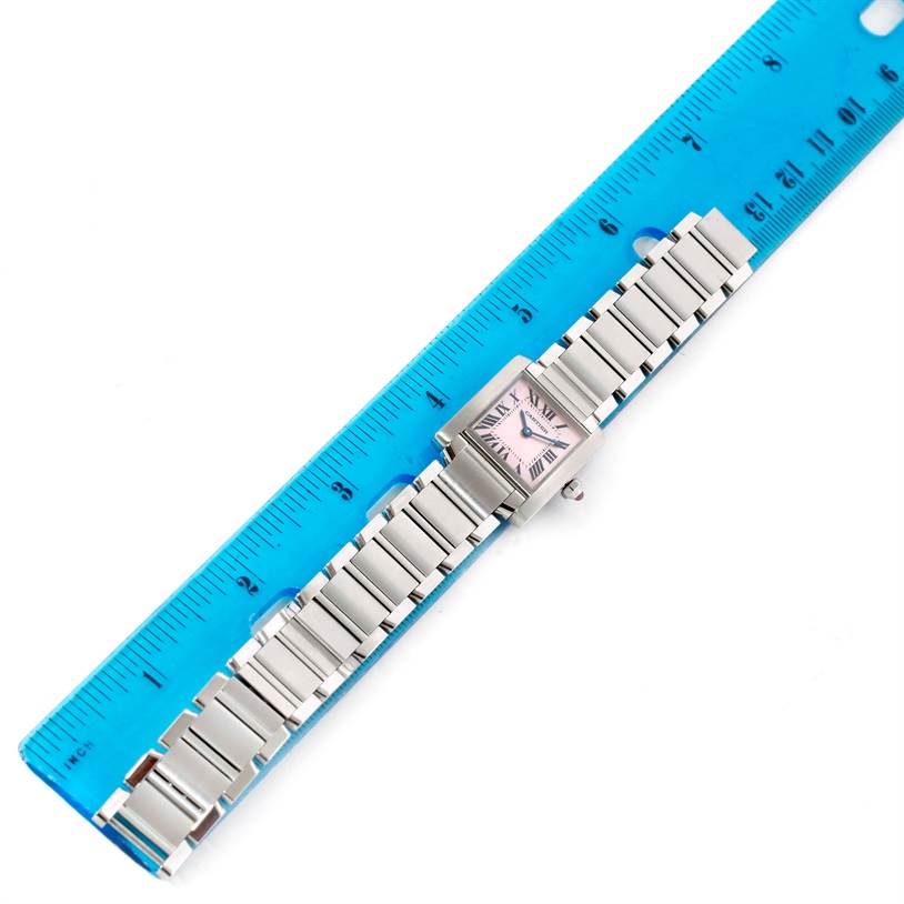 The Cartier Tank Francaise W51028Q3 Women's Stainless Steel Mother of Pearl Dial W51028Q3 Women's Stainless Steel Mother of Pearl Dial watch is shown from a top-down angle, alongside a blue ruler for scale.