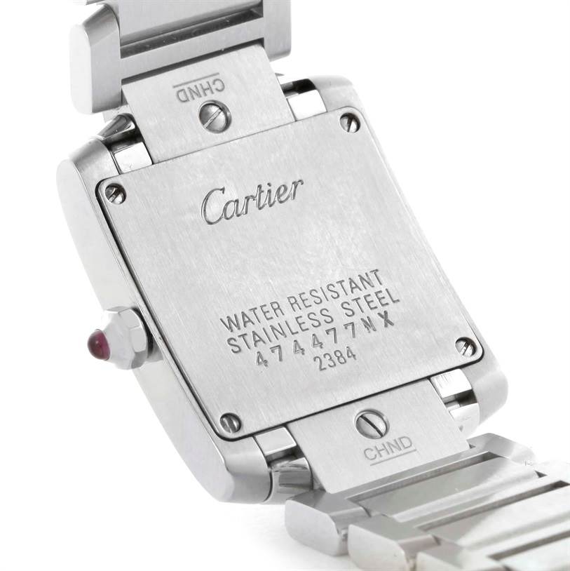The image shows the back of a Tank Francaise watch by Cartier, including the case back and part of the bracelet.