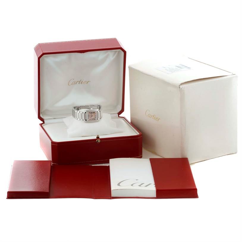 The Cartier Tank Francaise W51028Q3 Women's Stainless Steel Mother of Pearl Dial W51028Q3 Women's Stainless Steel Mother of Pearl Dial watch is shown in its open red box with additional packaging and booklets visible.
