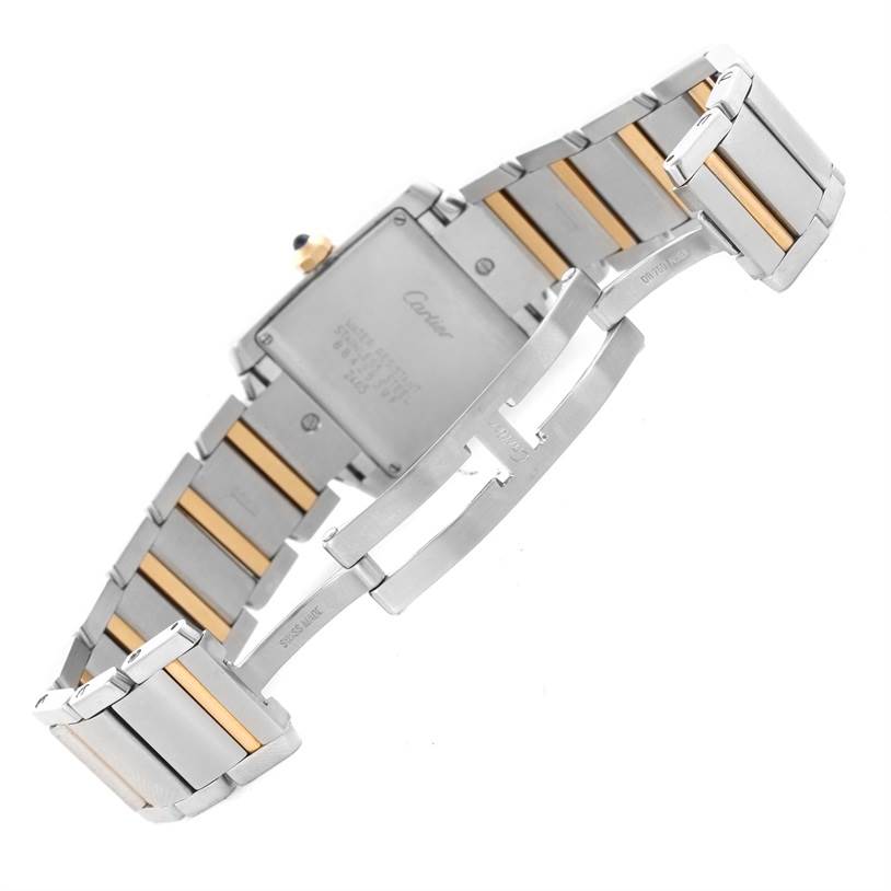 The image shows the back view and bracelet of the Cartier Tank Française watch, highlighting its stainless steel and gold design.