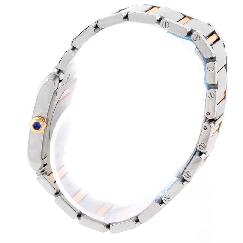 The image shows a side profile of a Cartier Tank Francaise W51012Q4 Women's Steel and Gold (two tone) Silver Dial W51012Q4 Women's Steel and Gold (two tone) Silver Dial watch, highlighting the bracelet and crown with a blue cabochon.