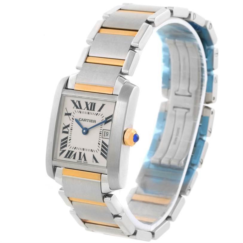 The image shows a side angle of a Cartier Tank Francaise W51012Q4 Women's Steel and Gold (two tone) Silver Dial W51012Q4 Women's Steel and Gold (two tone) Silver Dial watch displaying the face, bracelet, and crown.