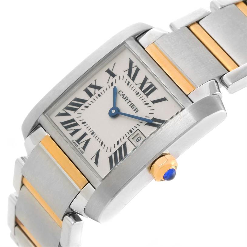 The image shows a close-up angled view of the Cartier Tank Française watch face, bracelet, and crown with a cabochon.