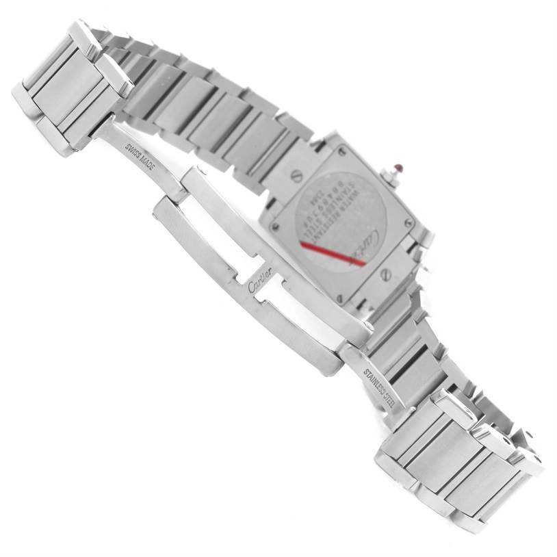 The image shows the back and bracelet of a Tank Française watch by Cartier, highlighting the clasp and stainless steel links.