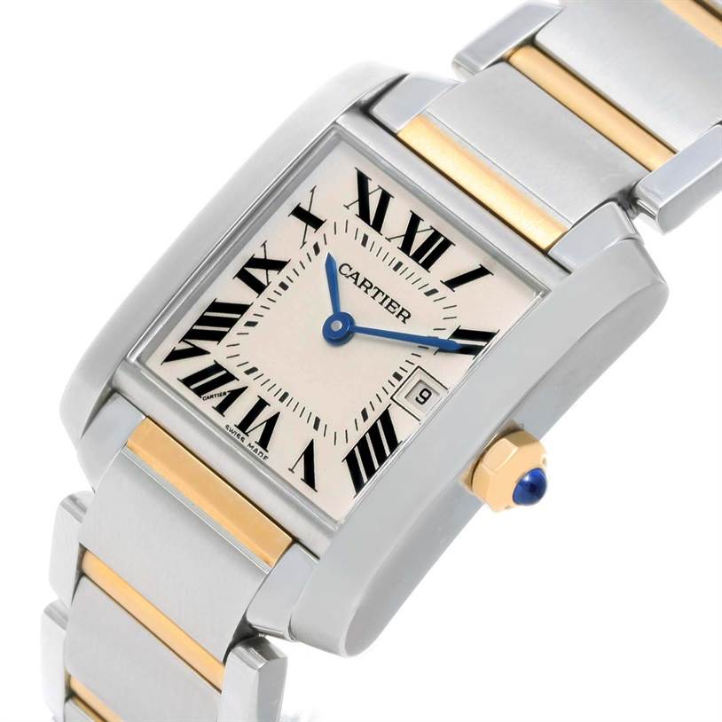 The image shows a close-up of the Cartier Tank Francaise W51012Q4 Women's Steel and Gold (two tone) Silver Dial W51012Q4 Women's Steel and Gold (two tone) Silver Dial watch, highlighting its face, Roman numerals, date window, and part of the bracelet.