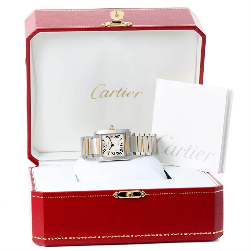 This image shows a Cartier Tank Francaise W51012Q4 Women's Steel and Gold (two tone) Silver Dial W51012Q4 Women's Steel and Gold (two tone) Silver Dial watch displayed in its box, with a partial view of the bracelet and accompanying documents.
