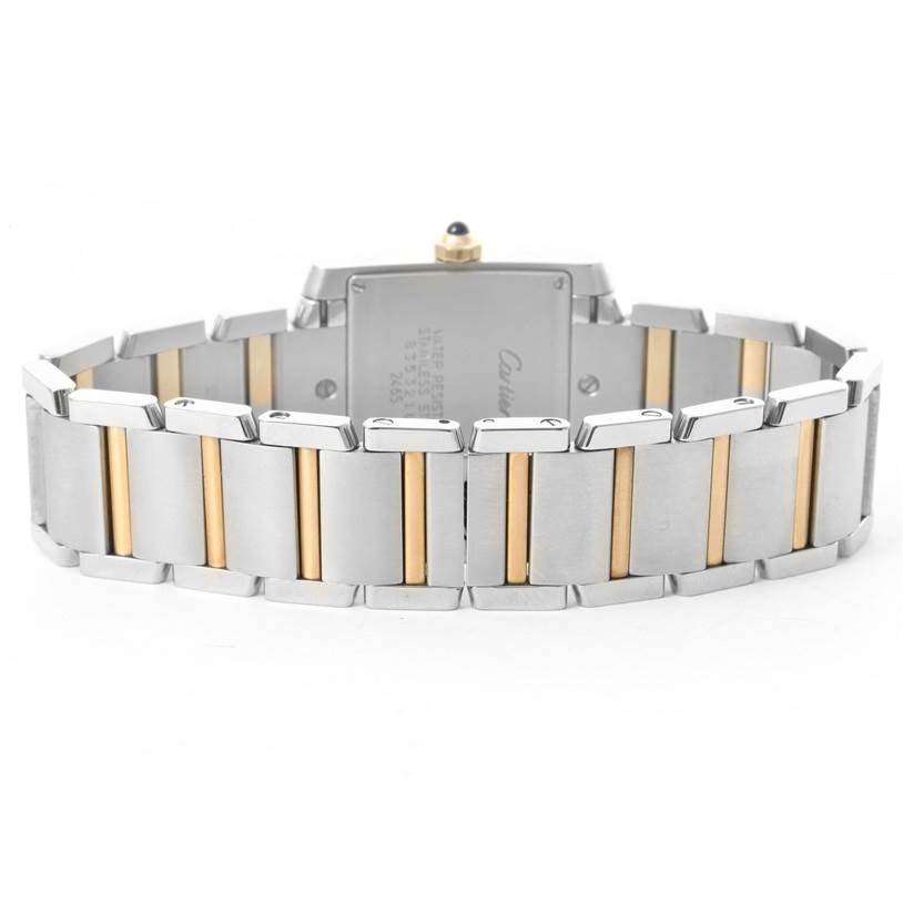The image shows the back of a Cartier Tank Francaise W51012Q4 Women's Steel and Gold (two tone) Silver Dial W51012Q4 Women's Steel and Gold (two tone) Silver Dial watch and its two-tone metal bracelet.