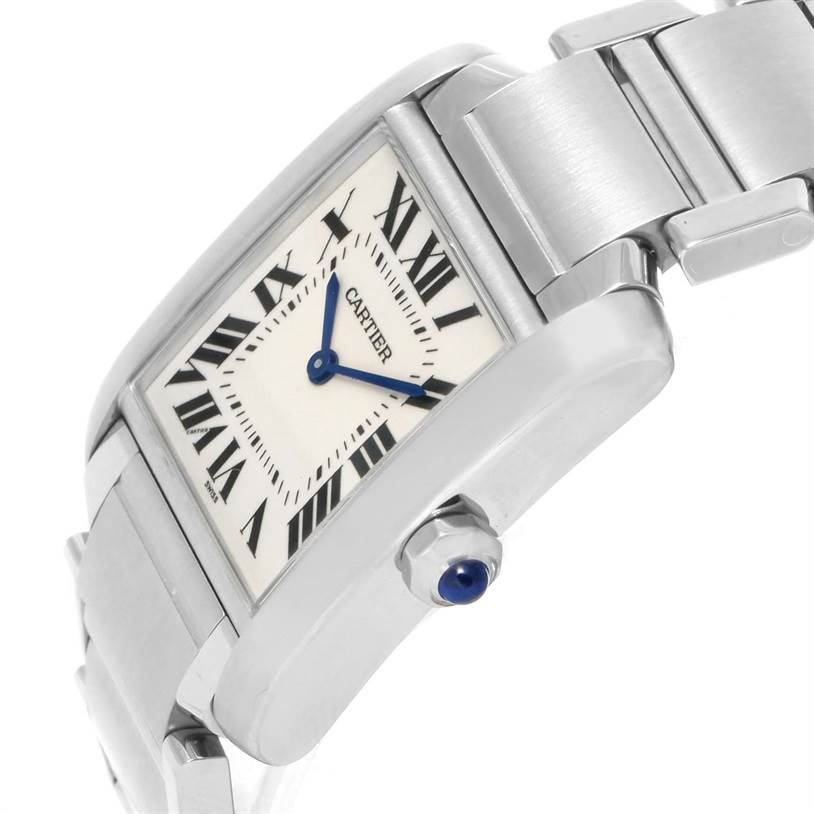 This image shows a close-up of a Cartier Tank Française watch at an angled view, highlighting its face, bracelet, and sapphire cabochon crown.