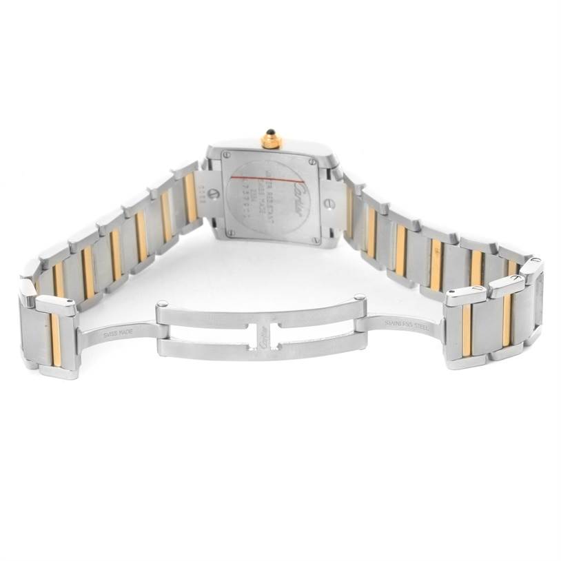 The image shows the back view of a Cartier Tank Francaise W51007Q4 Women's Steel and Gold (two tone) Silver Dial W51007Q4 Women's Steel and Gold (two tone) Silver Dial watch, highlighting its clasp and stainless steel and gold bracelet.