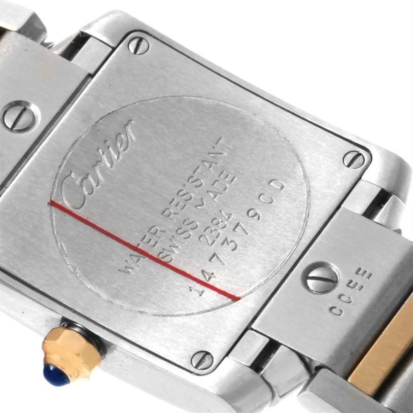 The image shows the back case and part of the bracelet of a Cartier Tank Francaise W51007Q4 Women's Steel and Gold (two tone) Silver Dial W51007Q4 Women's Steel and Gold (two tone) Silver Dial watch.