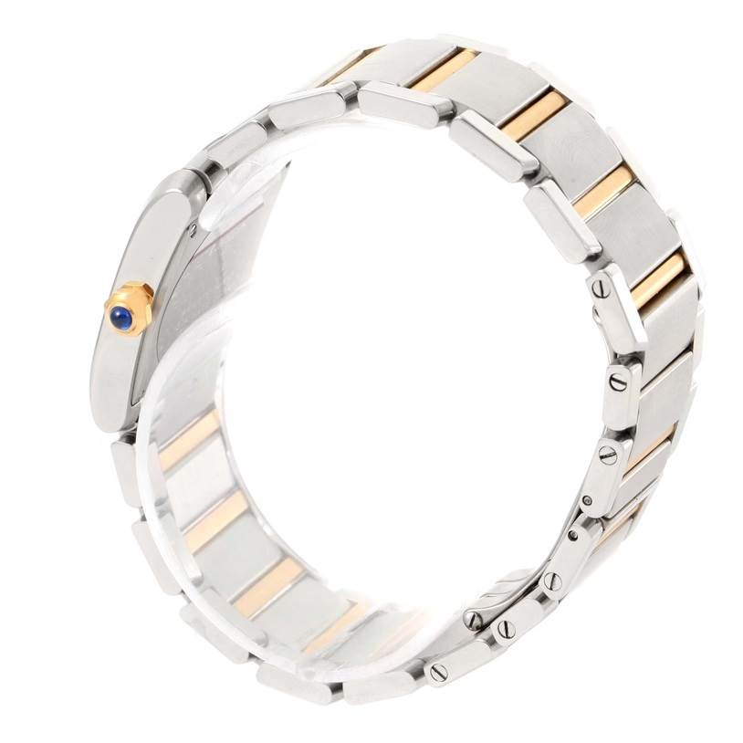 This image shows a Cartier Tank Francaise W51012Q4 Women's Steel and Gold (two tone) Silver Dial W51012Q4 Women's Steel and Gold (two tone) Silver Dial watch's metal bracelet and side view, highlighting its links and bejeweled crown.