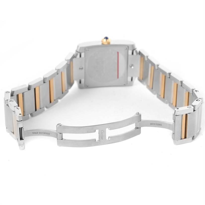 The image shows the back and open clasp of a Cartier Tank Francaise W51012Q4 Women's Steel and Gold (two tone) Silver Dial W51012Q4 Women's Steel and Gold (two tone) Silver Dial watch, highlighting its stainless steel and gold link bracelet.