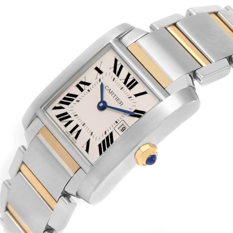 This is a Cartier Tank Francaise W51012Q4 Women's Steel and Gold (two tone) Silver Dial W51012Q4 Women's Steel and Gold (two tone) Silver Dial watch shown at an oblique angle, highlighting the dial, crown, and two-tone bracelet.