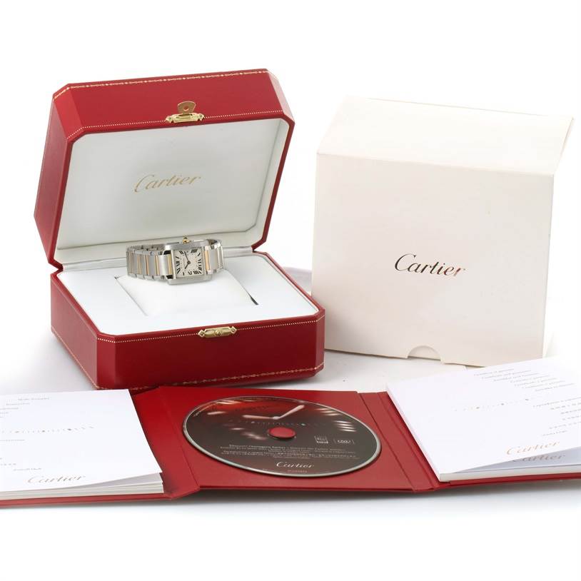 A Cartier Tank Francaise W51012Q4 Women's Steel and Gold (two tone) Silver Dial W51012Q4 Women's Steel and Gold (two tone) Silver Dial watch in its red box, accompanied by an outer box, booklets, and a CD.