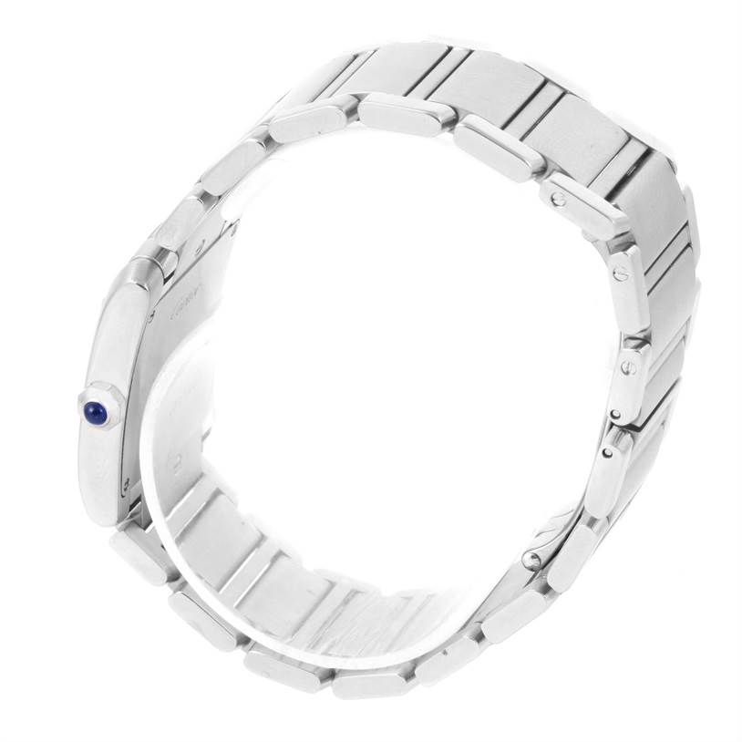 The image shows a side view of the Tank Française watch by Cartier, focusing on the bracelet and side profile, including the crown with a blue cabochon.